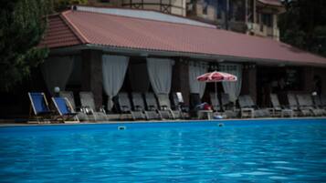 Seasonal outdoor pool, open 10:00 AM to 10:00 PM, free cabanas