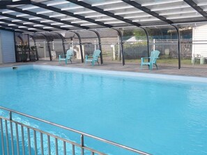 Seasonal outdoor pool, pool loungers