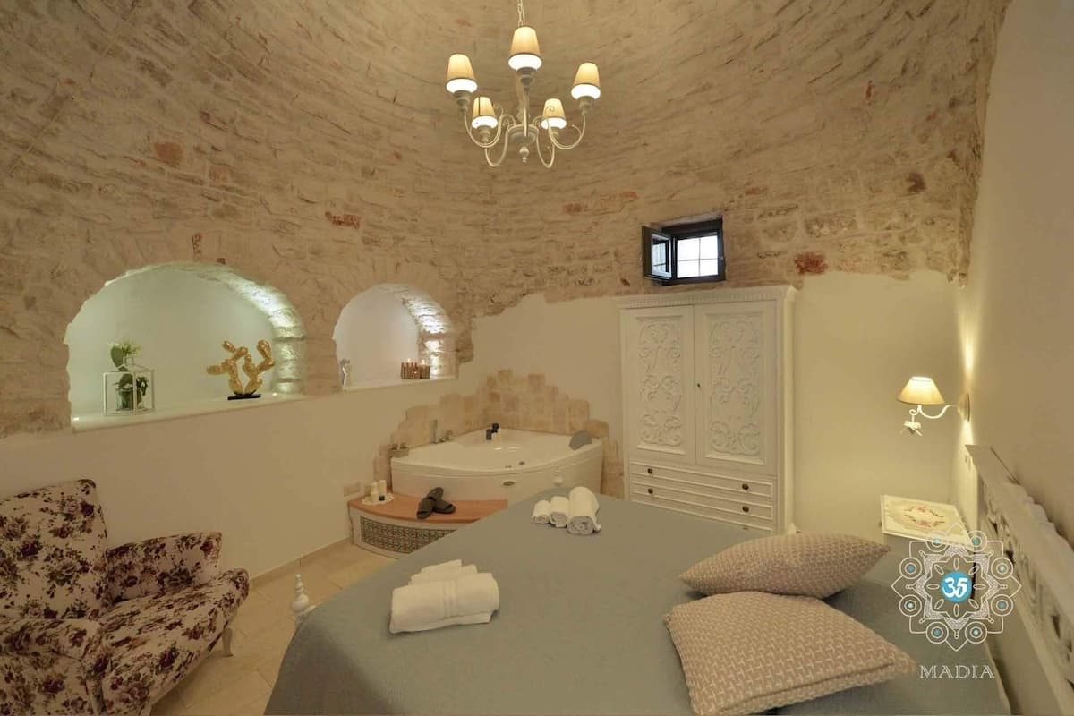 Suite de lujo, 2 habitaciones, hidromasaje (Ulivo) | Ropa de cama de alta calidad, edredón y camas con efecto memoria
