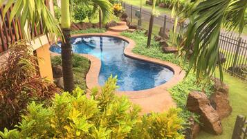 Outdoor pool, open 7:00 AM to 9:00 PM, pool loungers