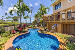 Outdoor pool, open 7:00 AM to 9:00 PM, pool loungers
