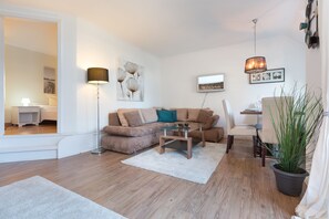 Flat-screen TV, DVD player, books, music library