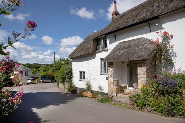 Kites Holt, an historic semi-detached cottage with parking for one car to the side of the property with EV Charging Point