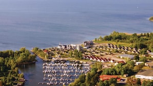 An aerial view of a lakeside residential area with a marina and houses. - 1 bedroom stunning apartment in Rechlin (Rechlin)