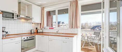 Fridge, stovetop, dishwasher, coffee/tea maker