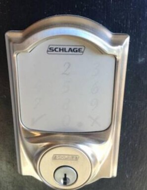 A SCHLAGE door lock with a numeric keypad. - Albany Hill Apartment (Berkeley)