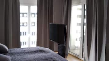 Premium bedding, memory-foam beds, desk, laptop workspace