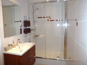 Shower, hair dryer, towels, toilet paper