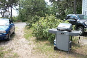 Gas grill and driveway