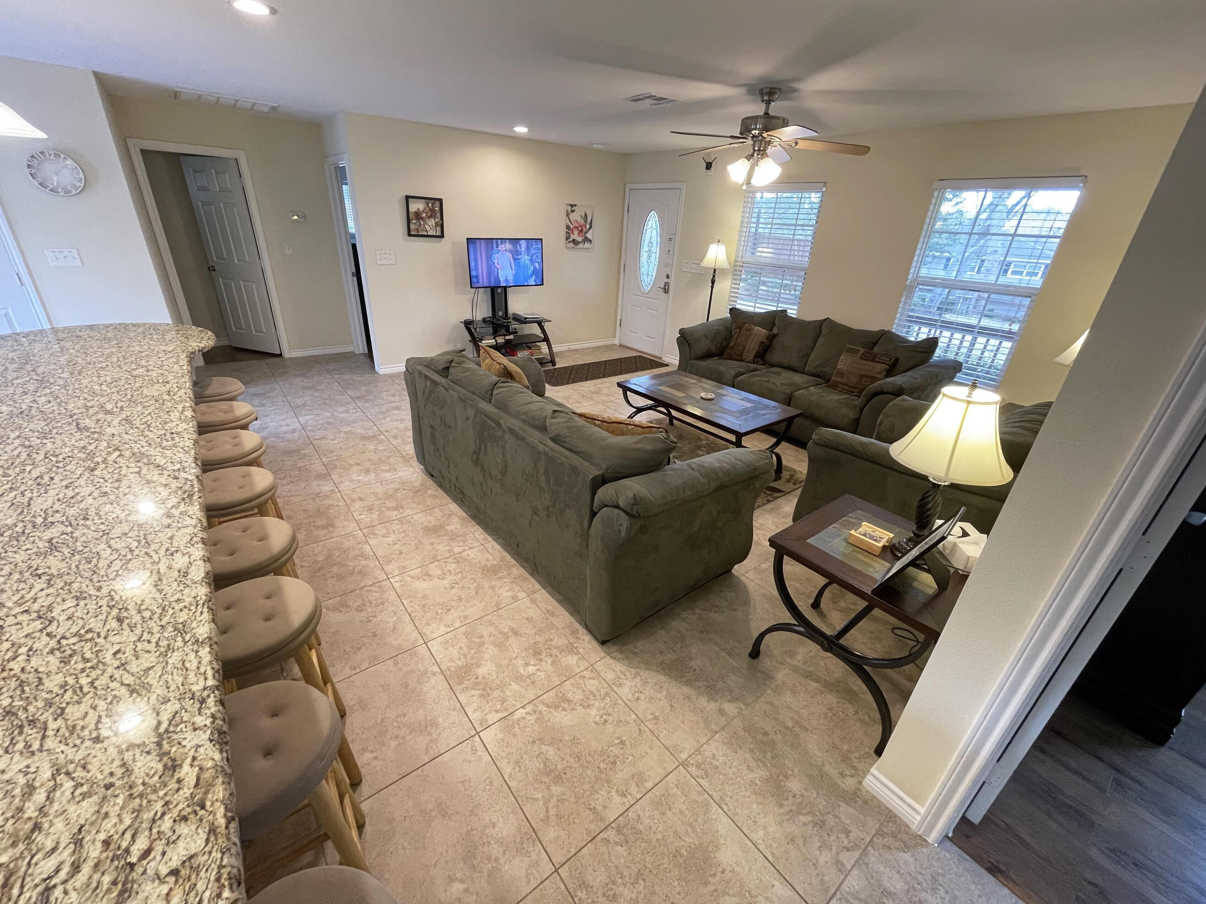 "Henry's Hideaway" A dock, kayaks, lake and a forest.