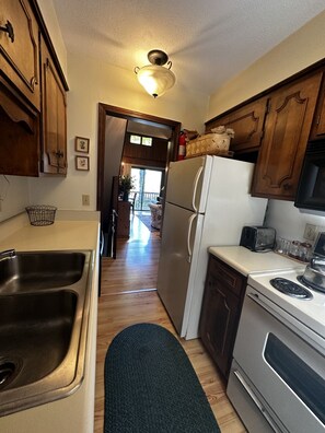 Fridge, stovetop, dishwasher, coffee/tea maker