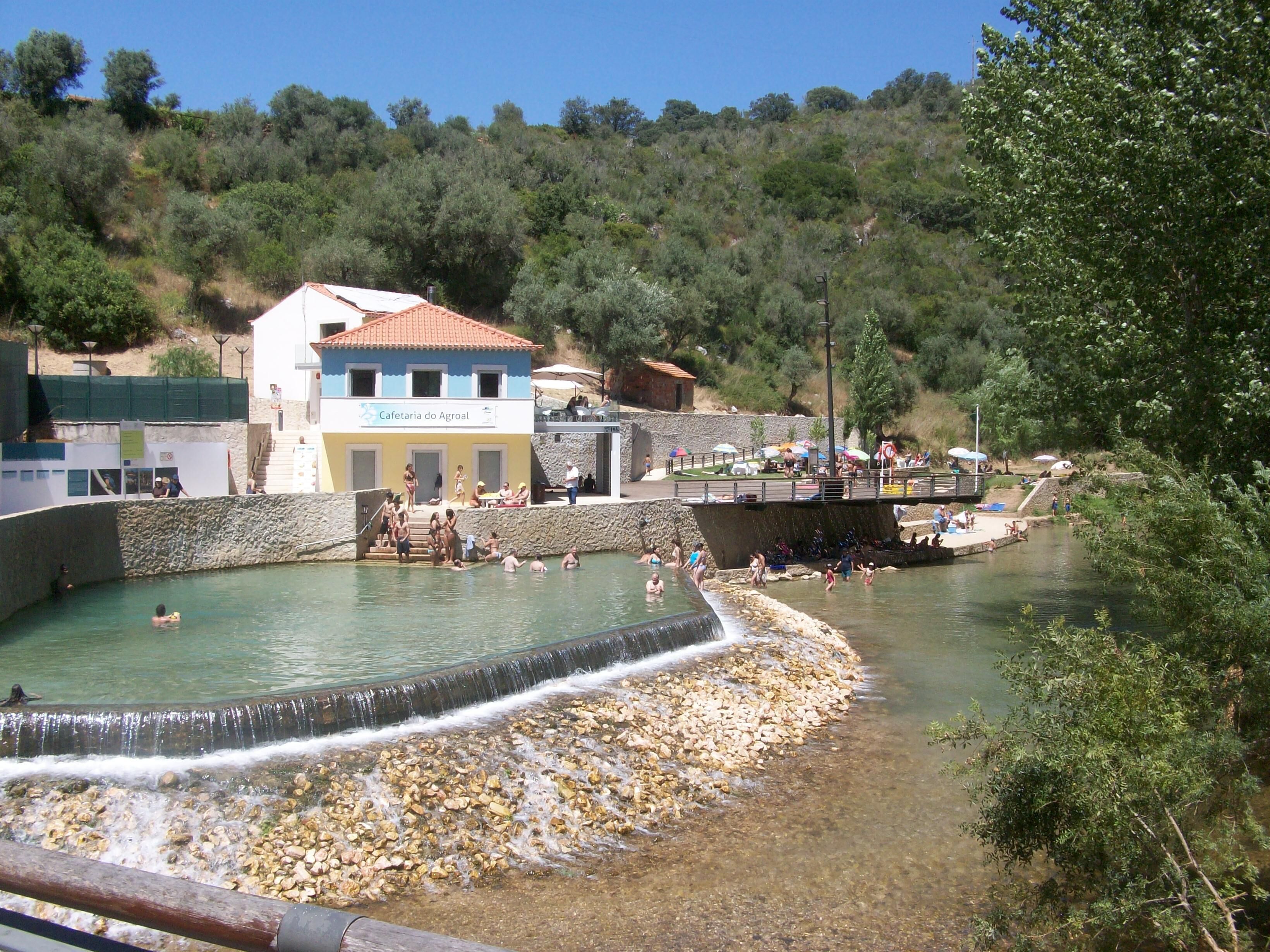 River beach at Agroal, safe swimming with cafes sun terraces