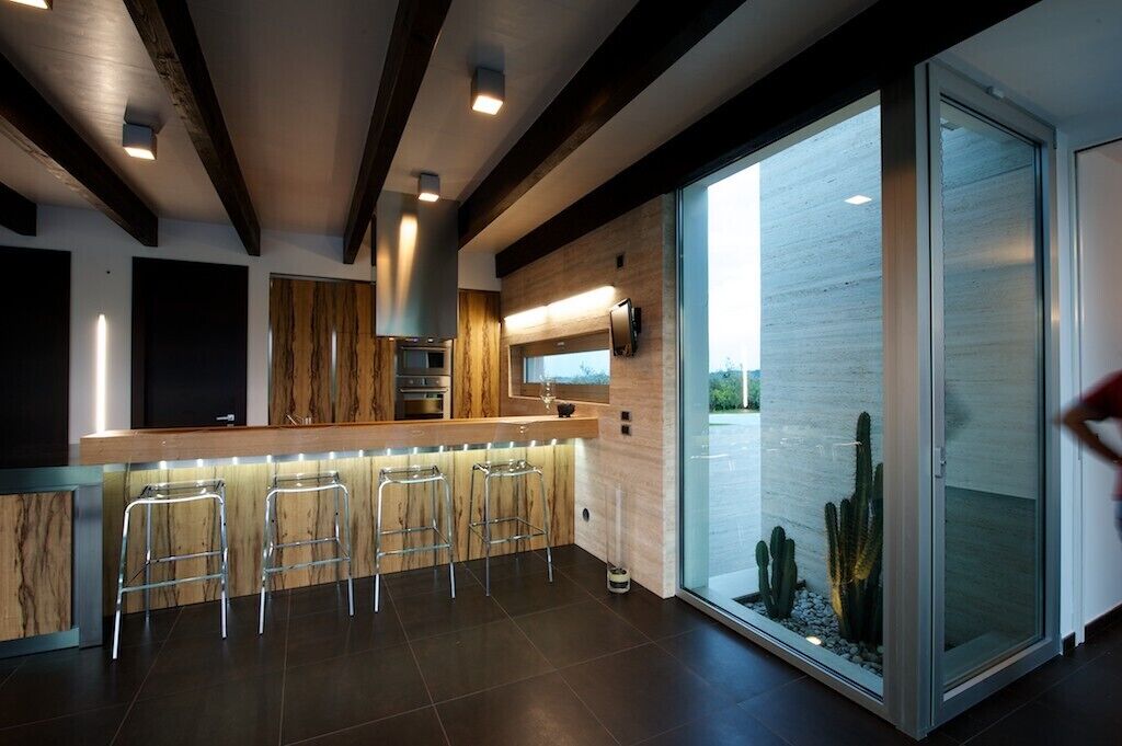 Modern villa with swimming pool surrounded by greenery