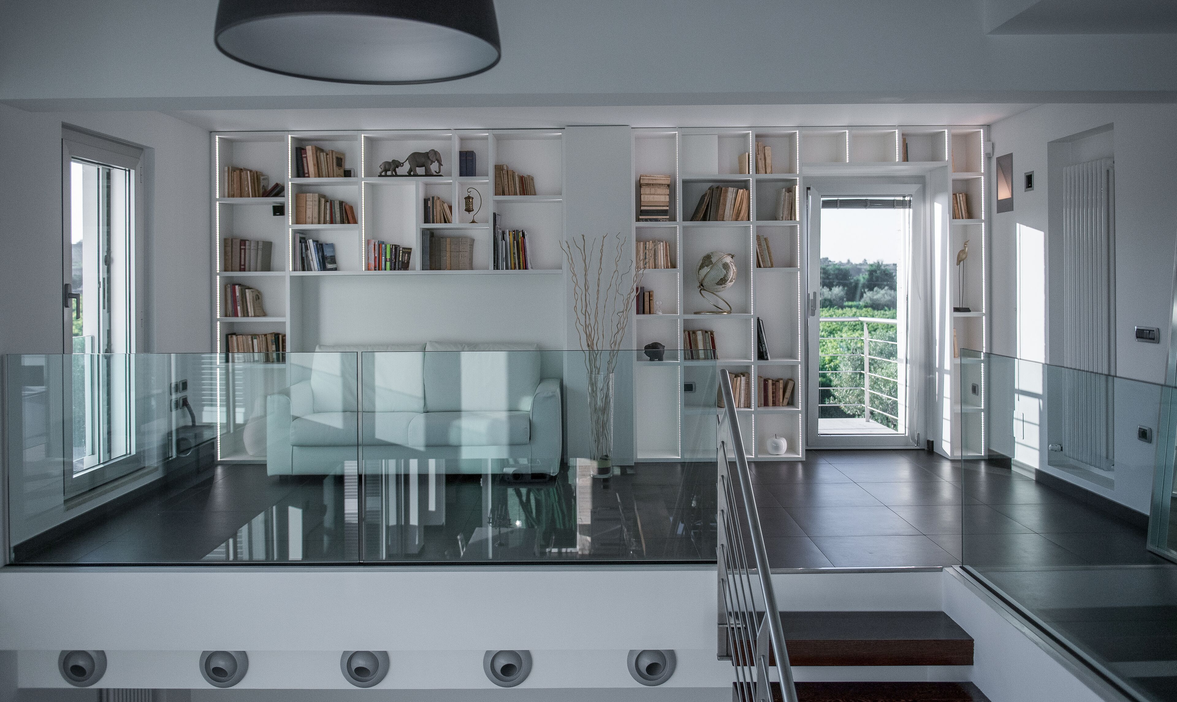 Modern villa with swimming pool surrounded by greenery