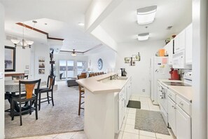 Enjoy cooking in this well-equipped kitchen with a central island and ample counter space.