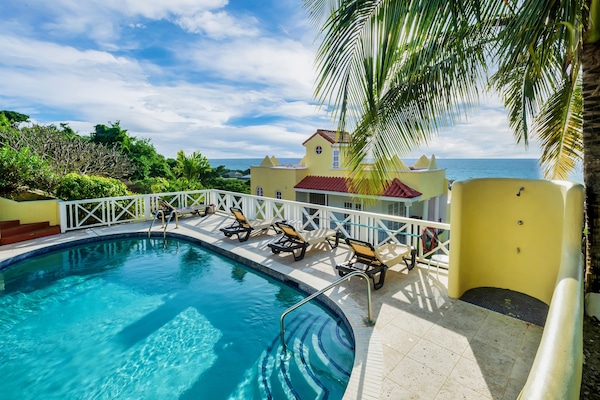 The pool with a view of the Caribbean Sea! Enjoy a dip as the sun sets!