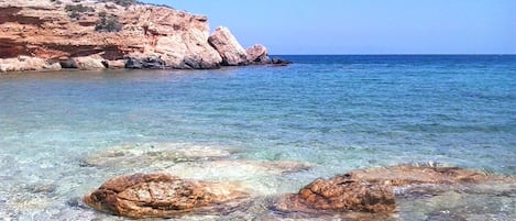 On the beach, sun-loungers