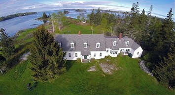 Aerial view of house w/ a 220-degree oceanfront view.