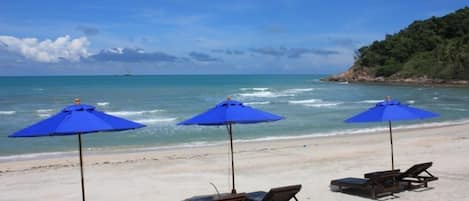 On the beach, sun-loungers, beach towels