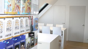 A reception area with a white desk, chairs, and a door in the background. - 2 Bedroom apartment near center Ghent (Gent)
