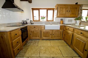 Oak kitchen with double Belfast sink.