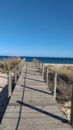A wooden boardwalk leading to a beach with clear skies. - RESORT VACATION WITH POOLS, SEA VIEW, TERRACE, WIFI AND AIR CONDITIONING (tavira)