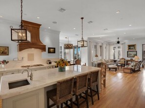 Enjoy cooking and dining in this open-plan kitchen with a central island and dining area.