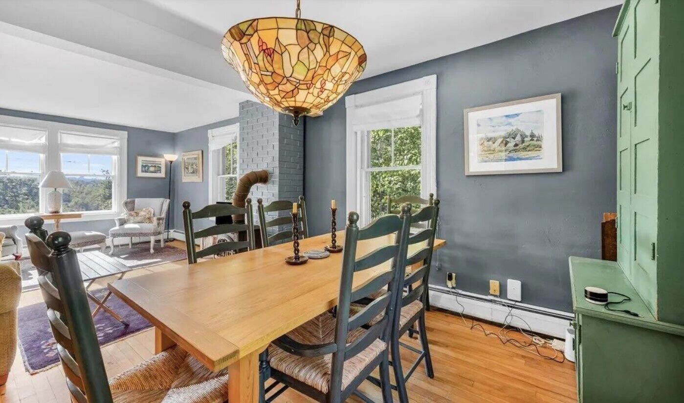 Dining table in the back of the living room. Custom-made table seats six.