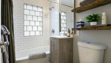 Combined shower/tub, hair dryer, towels, soap