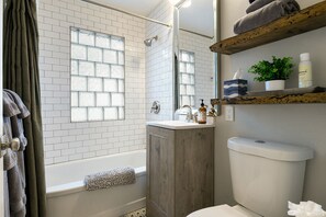 Combined shower/tub, hair dryer, towels, soap