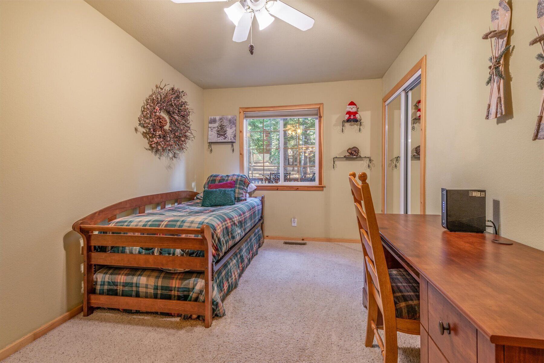 Downstairs bedroom trundle bed pulls out to two twin beds. Desk for remote work.