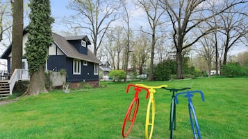 Guests can enjoy a home away from home surrounded by a beautifully maintained lawn and lush trees.
