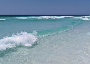A beach with clear turquoise water and waves. - ACROSS Str. BEACH! Golf Cart+Free Chair Srvc 6+CHILL PILL+PrivPool+6 King suites (Destin)