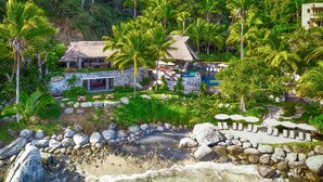 A tropical resort with a pool, thatched-roof structures, and a rocky beach. - Casa Las Hijas,Private Punta Sayulita, Gated Beach Club, 5 min to town, beach (Sayulita)