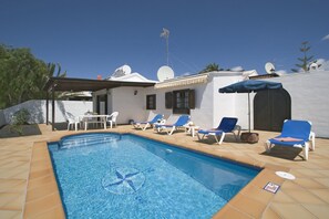 A heated pool, pool umbrellas, sun loungers
