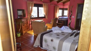 A bedroom with a bed, a desk, a chair, a television, and a window. - Spa in the house and an unbeatable view of Gredos. (San Juan de Gredos)