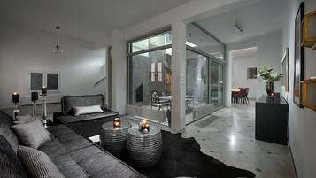 Deluxe Villa | Living area | Flat-screen TV