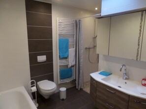 Bathtub, hair dryer, towels