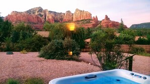 A hot tub in a garden with a view of red rock formations. - Uptown Sedona, Prime Location, HotTub VIEWS (Sedona)