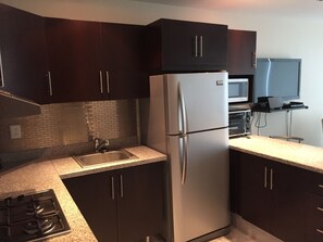 Fridge, microwave, stovetop, coffee/tea maker