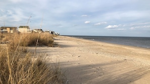 On the beach, sun loungers, beach towels