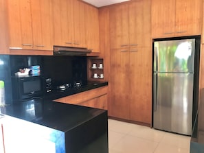 Fridge, microwave, stovetop, coffee/tea maker