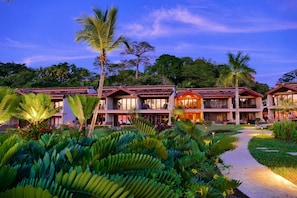 Casa Chocolate all lit up as seen from The Palms' lush gardens.