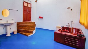 Deep soaking tub, rainfall showerhead, free toiletries, towels