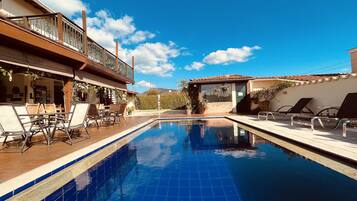 Outdoor pool, pool umbrellas, sun loungers