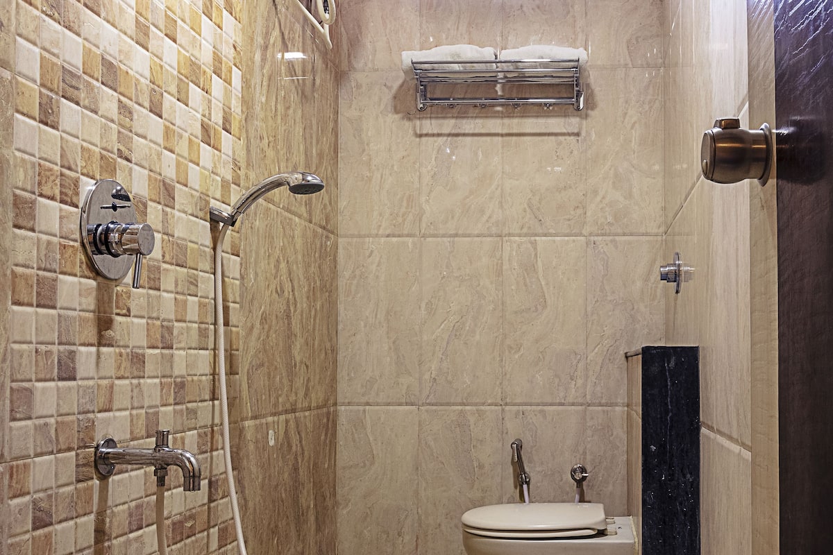 shower, rainfall showerhead, slippers, towels