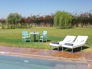 Seasonal outdoor pool, pool umbrellas, pool loungers