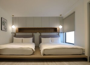 Family Quadruple Room, 2 Double Beds | Down comforters, individually furnished, desk, soundproofing - Slow Town Hotel - Konkai (Tainan)
