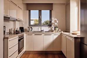 Saffron - Elaia Luxury Top Floor Condo with Private Pool | Private kitchen | Full-size fridge, microwave, oven, stovetop
