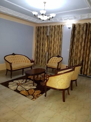 Superior Apartment, 2 Bedrooms, Terrace | Living area | 32-inch flat-screen TV with cable channels, TV - Hotel Residence Madadjeu (Yaoundé)